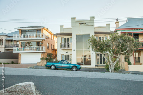 Seaside houses with a car parked out the front photo