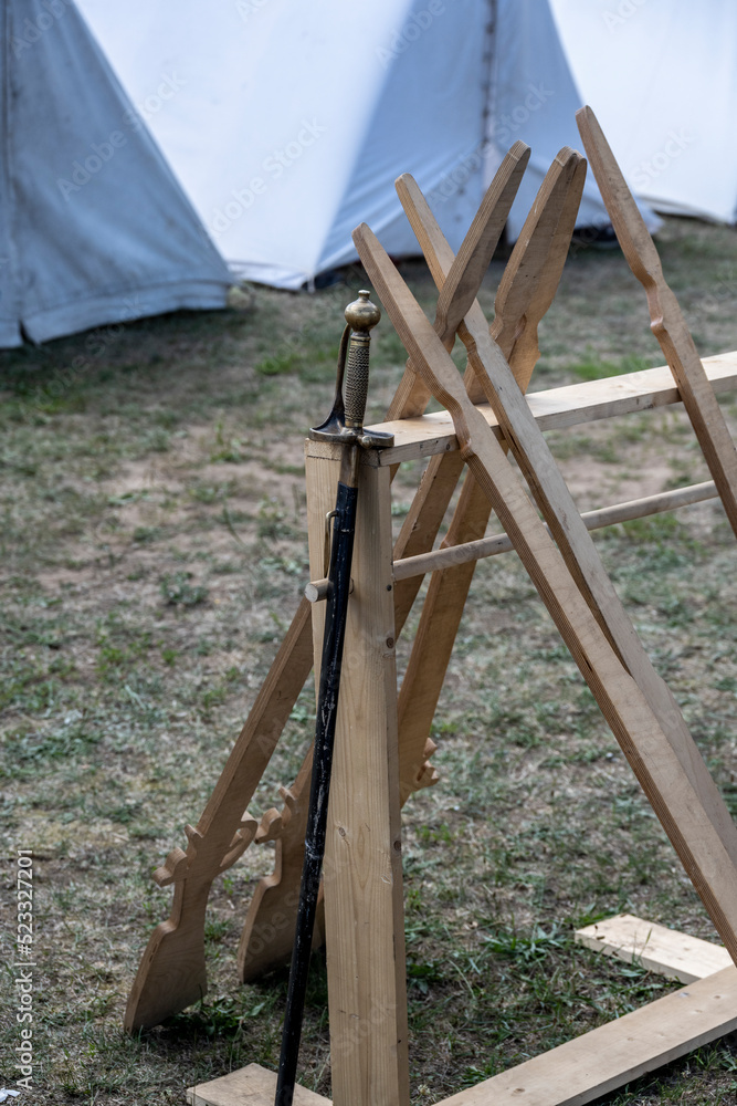 reconstruction of a 17th century military camp with tents and military utensils at a summer festival reconstruction of a 17th century military camp with tents and military utensils at a summer festival