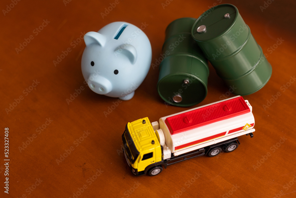 Obraz premium small toy combine with toy oil barrel