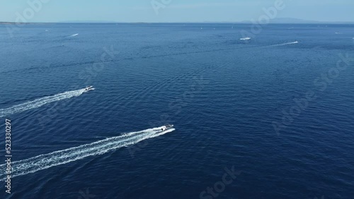 Wallpaper Mural speedboat leaves a white trail on the calm surface of the Adriatic Sea, Croatia, Rab island archipelago, summer Torontodigital.ca