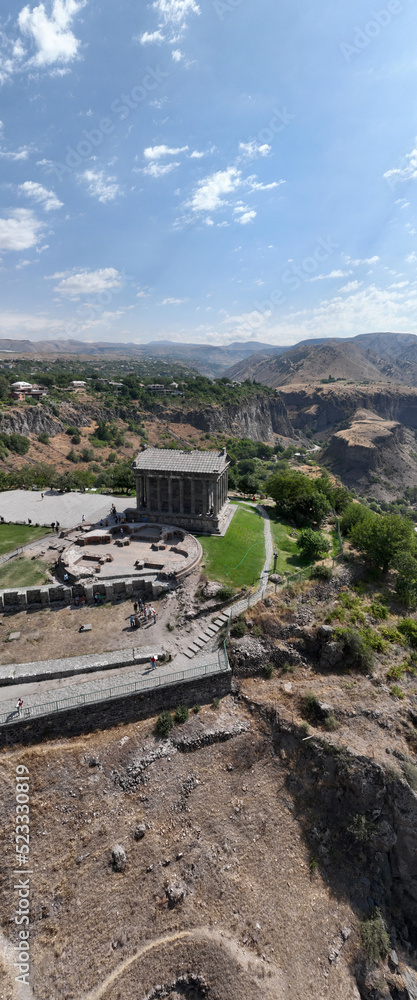 panoramic view of a mountain landscape with an old Christian church against the sky in Armenia taken from a drone