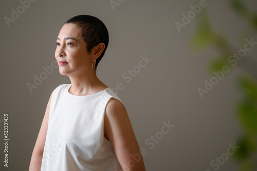 Beautiful woman in twilight, profile, foreground blur photo