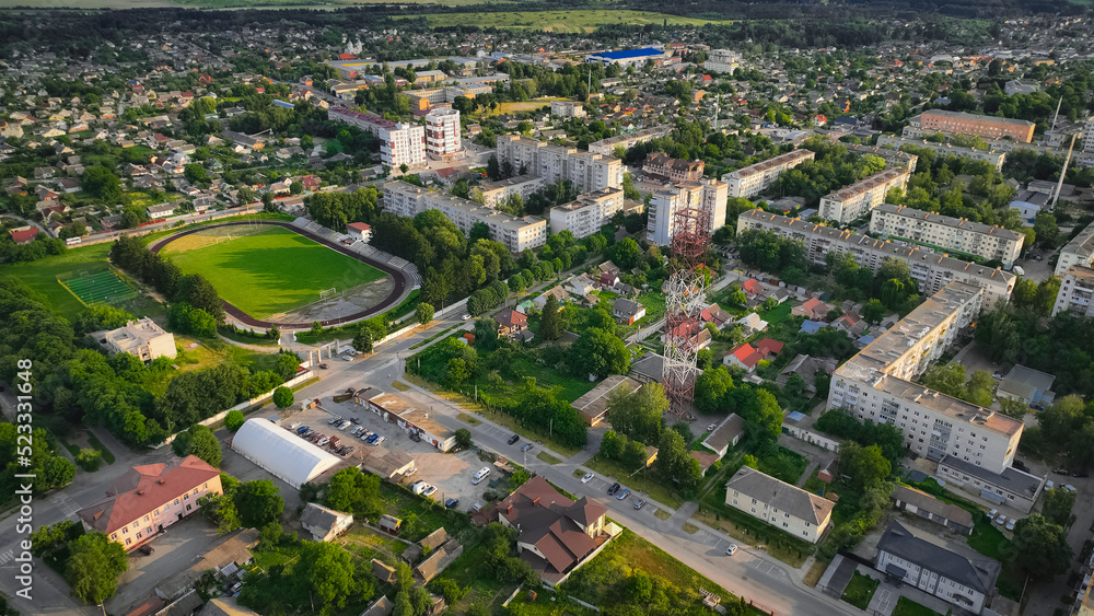 ordinary city living district of Eastern Europe with streets and stadium, aerial photography
