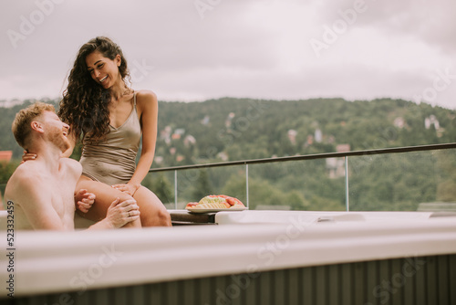 Young couple enjoying in ou...