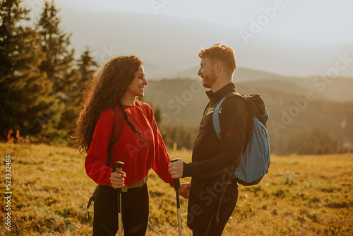 Smiling couple walking with...