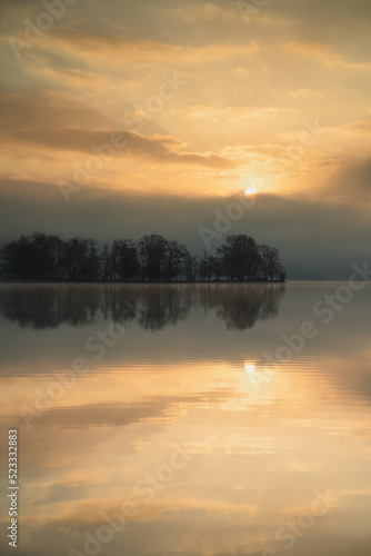 Sun rising over Loch And in Scotland on a beautiful morning