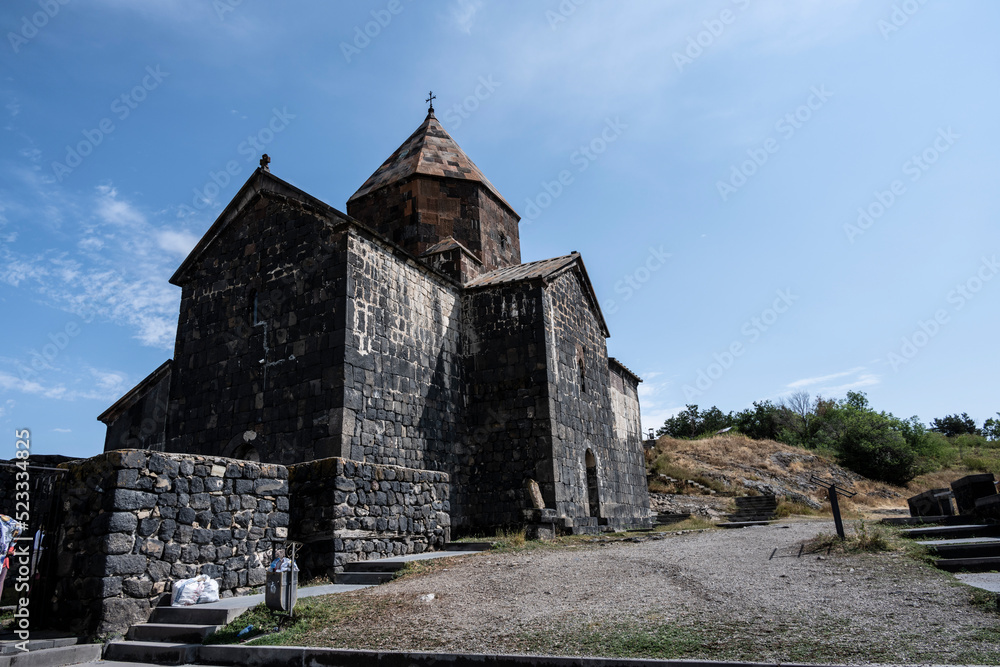 landscape with views of ancient stone buildings and temples on a summer day near Lake Sevan in Armenia