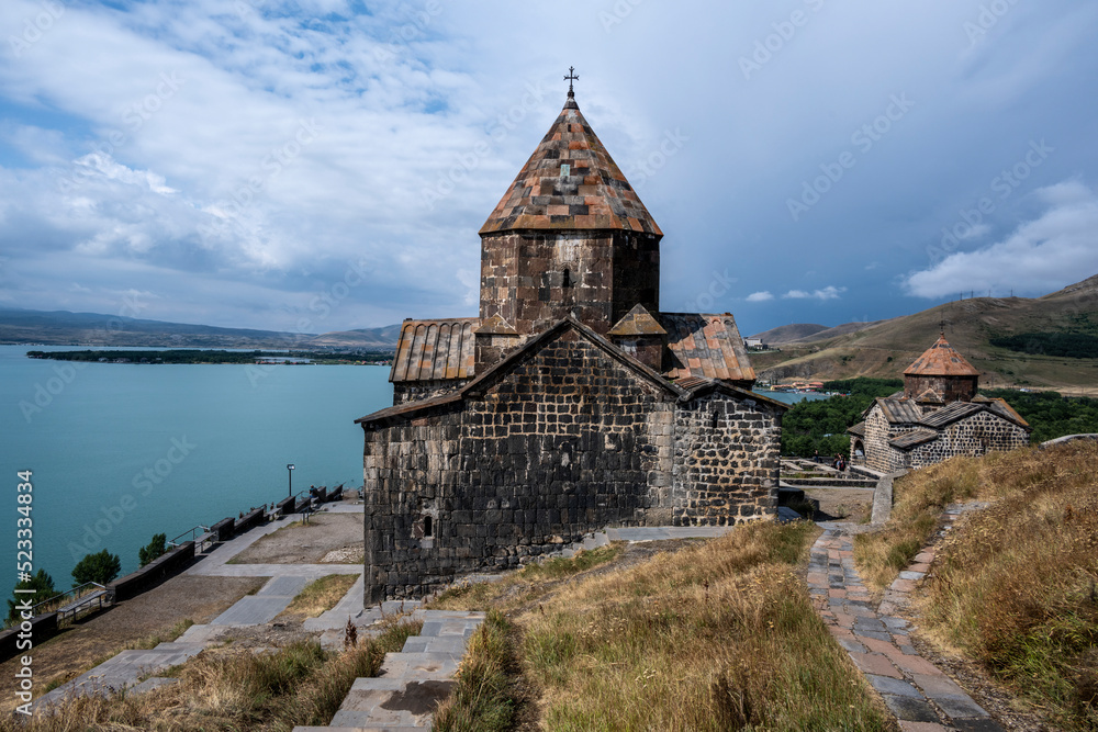 landscape with views of ancient stone buildings and temples on a summer day near Lake Sevan in Armenia