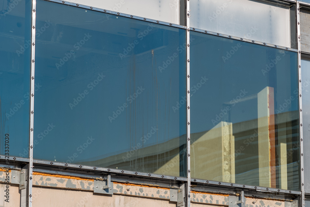 glazed window of run down old building