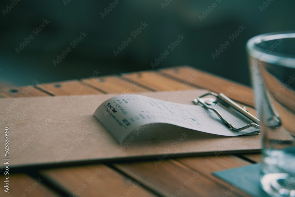 Fototapeta premium invoice bill ,Put on the dining table,in a restaurant,taken close-up.