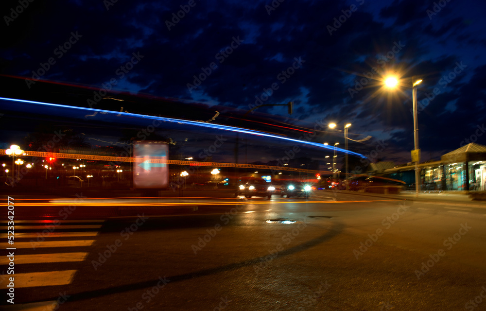Marker lights of transport in motion among the night city