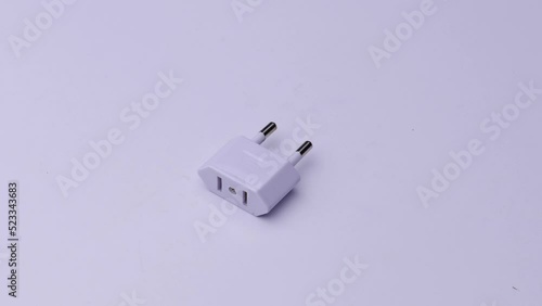 White plug close-up on a white background, video electronics.