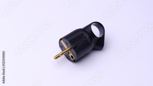 Black plug close-up on a white background, video electronics.