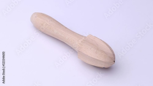 Crush citrus fruits close-up on a white background, video of kitchen accessories.