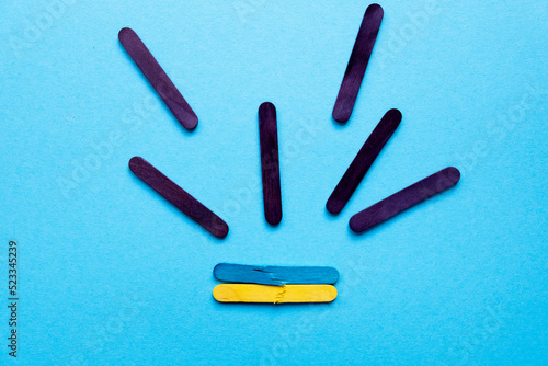 war in Ukraine. Broken Ukrainian flag on a blue background. Rockets fly to Ukraine