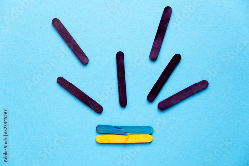 War in Ukraine. political conflict. Rocket attacks on Ukraine. Flag of Ukraine from colored sticks.