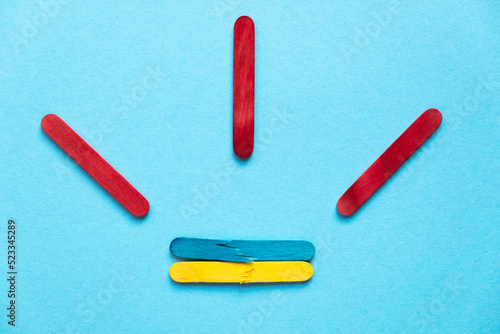 broken flag of ukraine on a blue photo. Attention to Ukraine