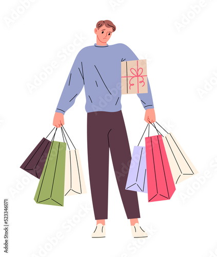 Man carrying many bags from store
