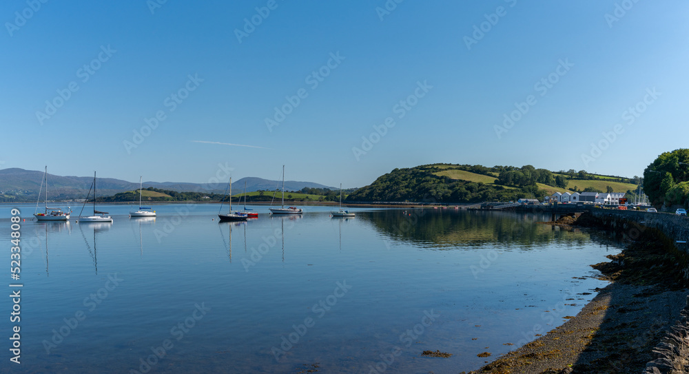 many sailboats anchored in the calm waters of Bantry Bay on the outskirts of Bantry village