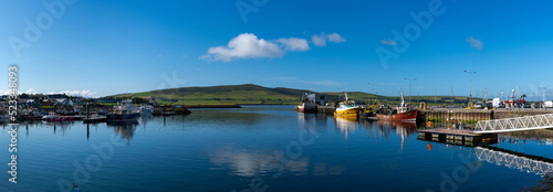 panorama landscape view of the fishing port and docks at Dingle Harbor in County Kerry photo