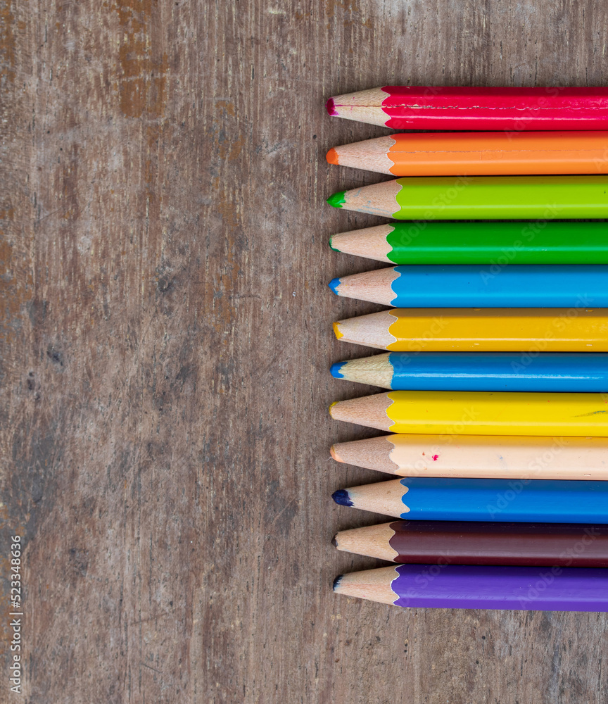 blunt coloured pencils on wood floor. blunt coloured pencils on wood floor.