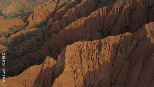 Mars Canyon in Issyk Kul Region in Kyrgyzstan. Epic sand formation. Mountains. Drone movement 4K. photo