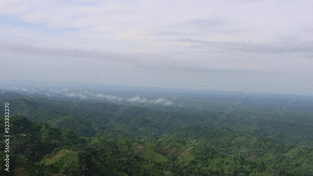 Aerial drone shot of a mountain area. Hill and sky horizon footage with a drone. Landscape mountain view with cloudy sky and green hills. Slow Motion 4K view of mountains and cloudy sky horizon. Aerial drone shot of a mountain area. Hill and sky horizon footage with a drone. Landscape mountain view with cloudy sky and green hills. Slow Motion 4K view of mountains and cloudy sky horizon.