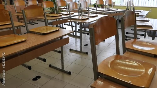 Empty school classroom with desks