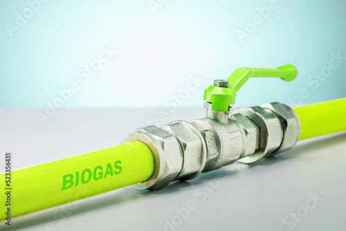 Pipeline with biogas on green background. Ecology solution bio energy. Eco concept. photo