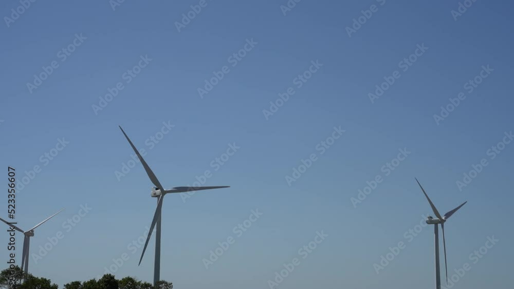 Pan down to wind turbines in a dry and arid heatwave landscape_Ungraded Pan down to wind turbines in a dry and arid heatwave landscape_Ungraded