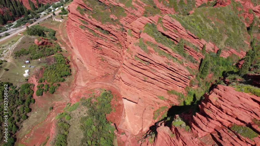Jeti-Oguz Gorge Issyk Kul Region in Kyrgyzstan. Big red rock formation. Slow shot from drone 4K. Jeti-Oguz Gorge Issyk Kul Region in Kyrgyzstan. Big red rock formation. Slow shot from drone 4K.