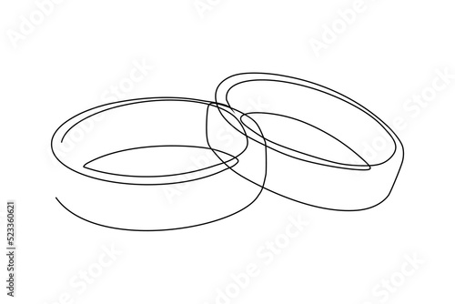 Single continuous line drawing of two rings. design for couple or wedding concept