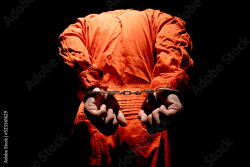Canvas Print Handcuffs on Accused Criminal in Orange Jail Jumpsuit