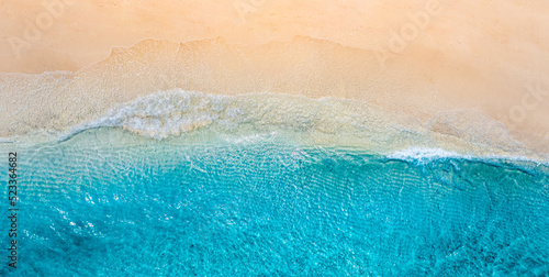 Summer panorama seascape landscape waves, blue sea water sunny day. Top view from drone. Sea aerial view, amazing tropical nature background. Beautiful Mediterranean waves surf splashing panorama