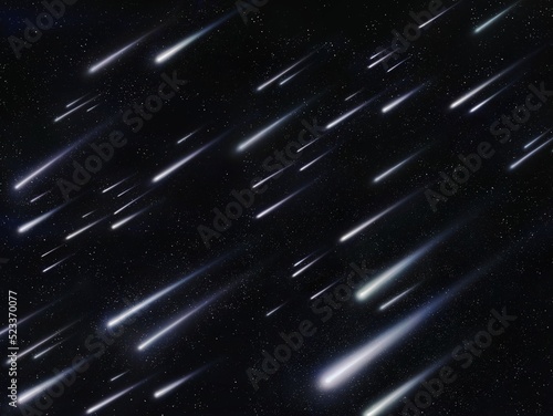 Meteor shower in the night sky against the background of stars. Meteorites burn in the atmosphere. Beautiful falling stars.