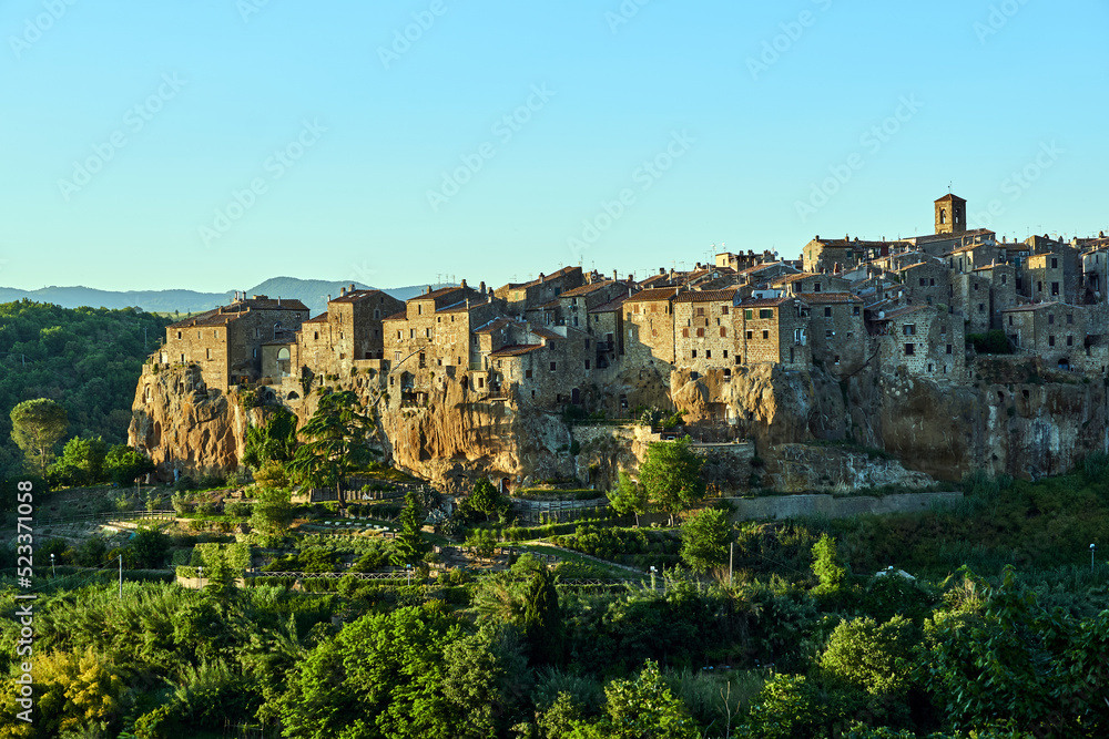 Medieval stone buildings on a rocky cliff in the town of Pitigliano in Tuscany, Italy
