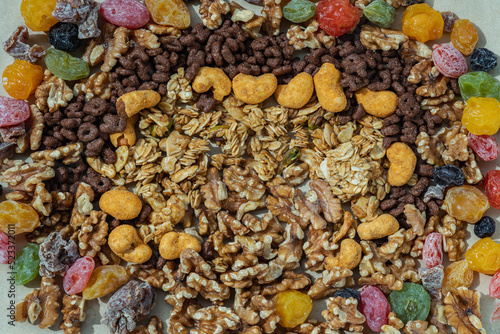 Mix of Healthy Snack of nuts and Other Dried fruits mix on gray background. Organic and healthy breakfast. Top view  Selective focus.