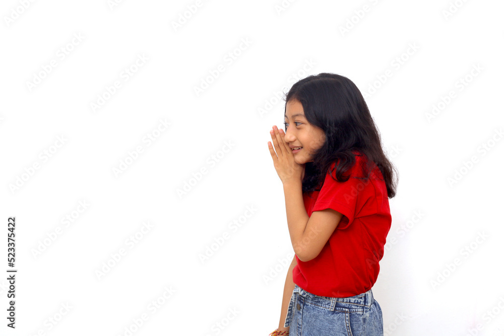 Asian little girl putting hand on mouth telling secret rumor, whispering malicious talk conversation Asian little girl putting hand on mouth telling secret rumor, whispering malicious talk conversation