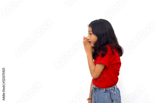 Картината върху платно Asian little girl putting hand on mouth telling secret rumor, whispering malicio