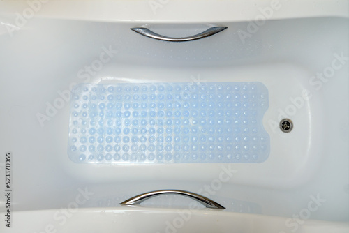 Non-slip blue mat with pimples in the bathroom Anti slip carpet in the bathroom for washing