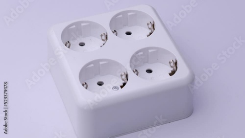 Socket extension cord 4 pieces close-up on a white background, video electronics.