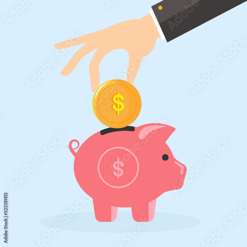 A man puts a coin in a piggy bank. The topic of savings.