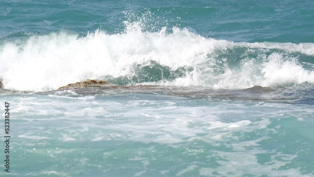 Storm on the sea. Beautiful strong big waves with foam during a summer storm on the Cretan Sea Storm on the sea. Beautiful strong big waves with foam during a summer storm on the Cretan Sea