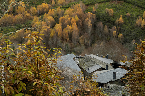 Small village in the mountain with traditional black slate roof photo