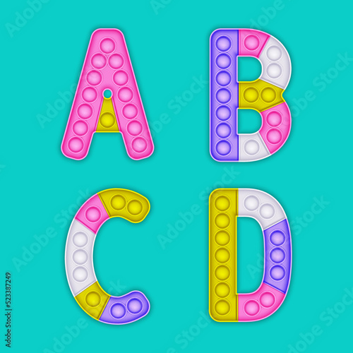 Children's pop it alphabet. A set of realistic antistress toys in the form of an letters.