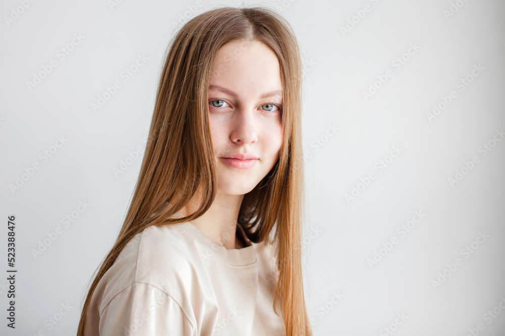 Portrait of young beautiful cute cheerful girl smiling over white background Portrait of young beautiful cute cheerful girl smiling over white background