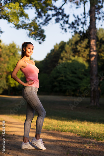 Young fitness woman exercise in summer nature