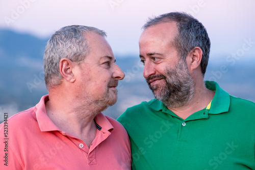 Men looking at each other with love photo