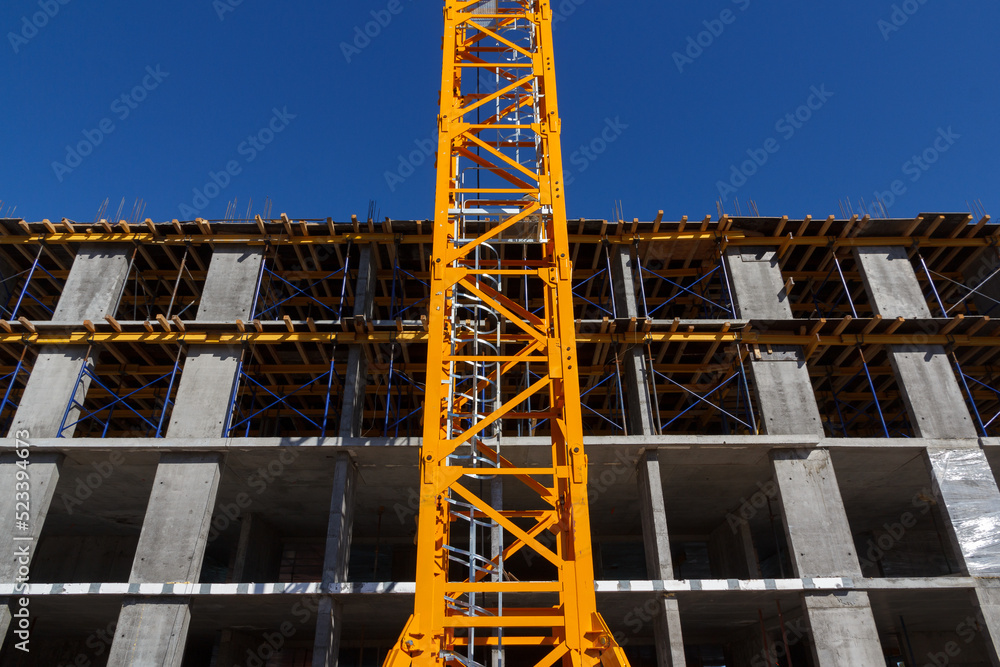 Construction of a residential building. Part of urban real estate and architecture. Facade of a residential building. Construction of a residential building. Part of urban real estate and architecture. Facade of a residential building.