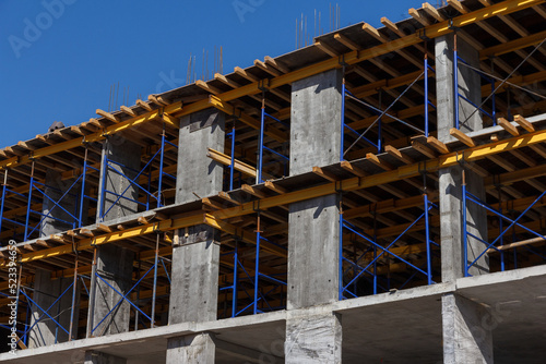 Construction of a residential building. Part of urban real estate and architecture. Facade of a residential building.